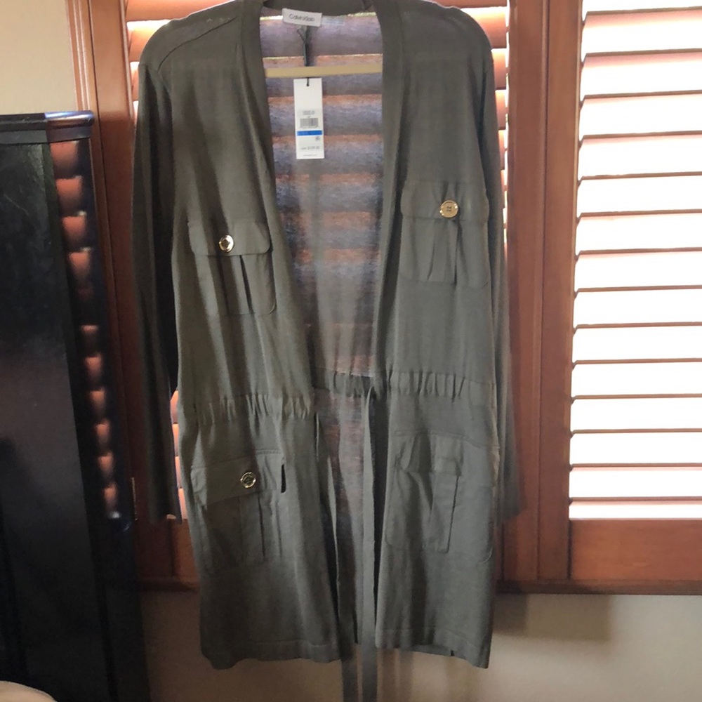 a new green calvin klein sweater